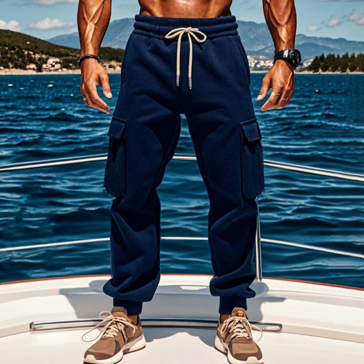 Męskie jednokolorowe dresowe spodnie z elastycznym pasem i wieloma kieszeniami 92171594Z